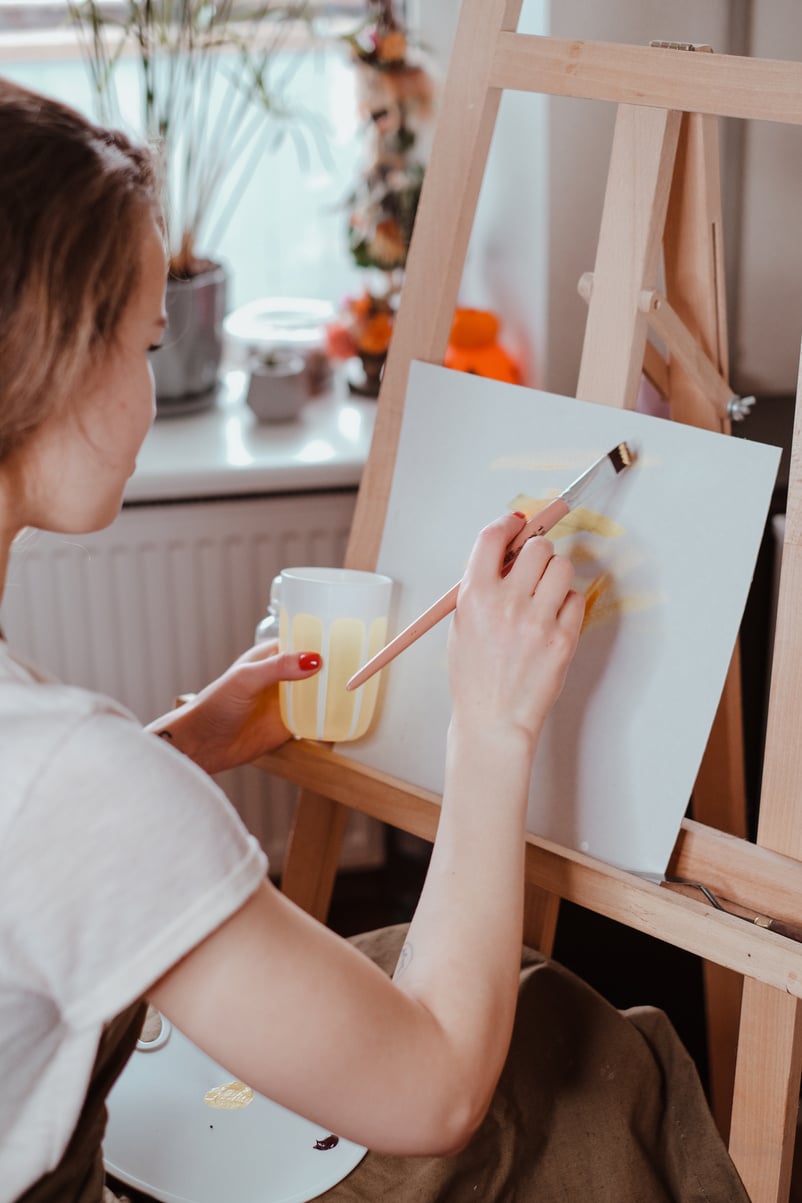 Woman Painting on Canvas